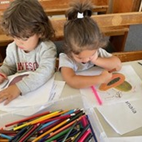 Two children coloring